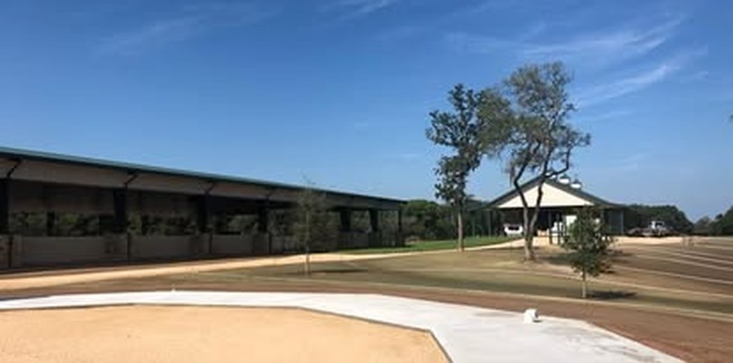 After: the same view with the ground finished and grass coming in